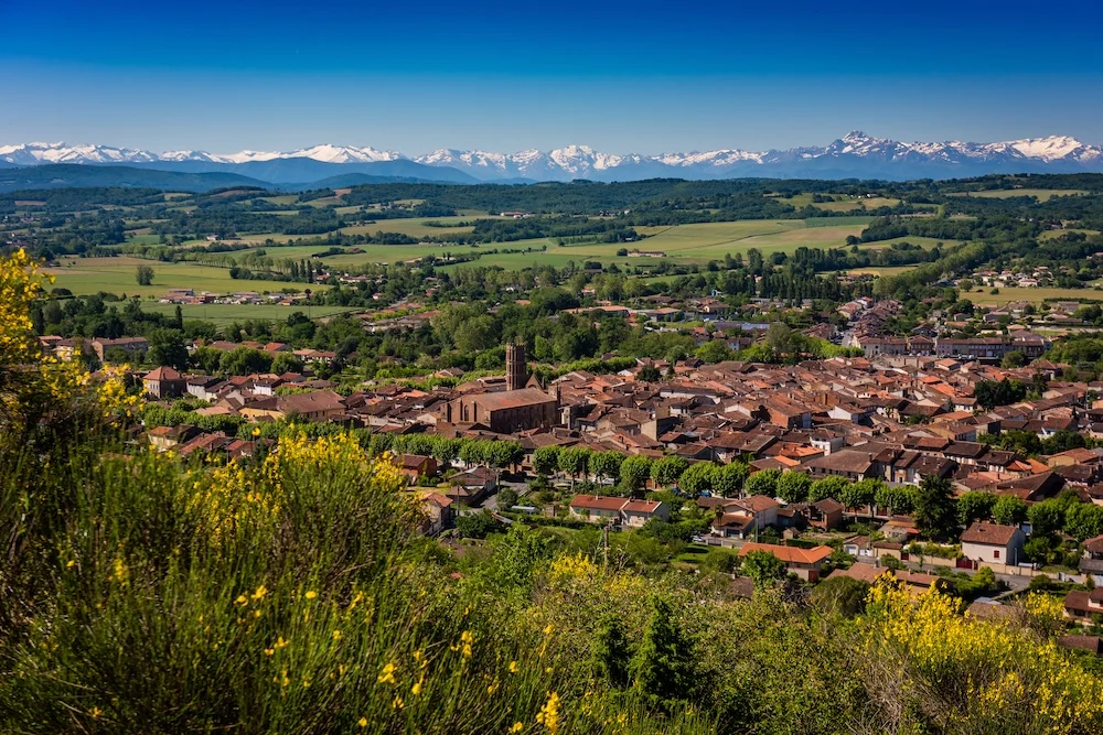 Montesquieu-Volvestre and the snow-capped Pyrenees