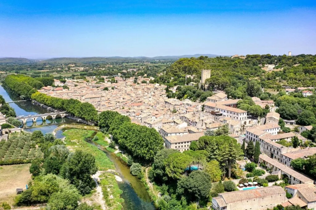 Aerial view of Sommières and its Roman bridge over the Vidourle, Gard