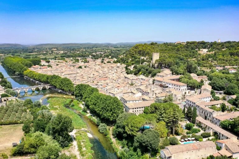 Aerial view of Sommières and its Roman bridge over the Vidourle, Gard